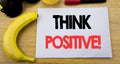 Think Positive. Business concept for Positivity Attitude written on sticky note empty paper, wooden background with copy space, su Royalty Free Stock Photo