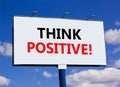 Think positive symbol. Concept words Think positive on beautiful big white billboard. Beautiful blue sky cloud background. Royalty Free Stock Photo