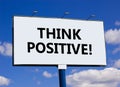 Think positive symbol. Concept words Think positive on beautiful big white billboard. Beautiful blue sky cloud background. Royalty Free Stock Photo