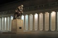 The Thinker statue at night