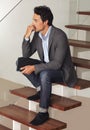Thinking, anxiety and business man waiting on stairs of office building with stress, fear or worry. Hiring, human Royalty Free Stock Photo