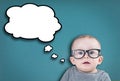 Thinking baby with glasses Royalty Free Stock Photo