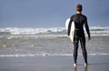 Thinking, beach and back of man with surfboard at beach for surfing waves on vacation, weekend and holiday. Travel Royalty Free Stock Photo