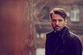 Thinking beard business man looking serious outdoor on city background. Closeup