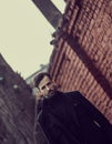 Thinking beard business man looking serious outdoor on city background. Closeup toned portrait