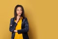 Thinking black woman on vivid yellow background