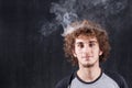 Thinking boy with smoking head Royalty Free Stock Photo