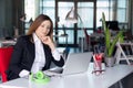 Thinking Business Lady in official clothing sitting at Office Table Royalty Free Stock Photo