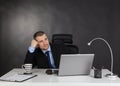 Thinking businessman in office. Royalty Free Stock Photo