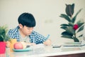 Thinking child bored and fed up doing his homework Royalty Free Stock Photo