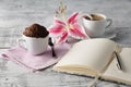 Thinking in coffee time with teacup cupcake Royalty Free Stock Photo