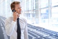 Thinking, deal or confident businessman on a phone call talking, networking or speaking in office. Smile, mobile Royalty Free Stock Photo