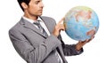 Thinking of expansion. A handsome businessman pointing out his next destination on a globe. Royalty Free Stock Photo