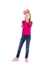 Thinking girl with a big pink hair bow. Royalty Free Stock Photo