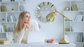 Thinking girl with laptop at the desk at home office Royalty Free Stock Photo