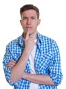 Thinking guy in a checked shirt Royalty Free Stock Photo