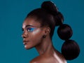 Thinking, hair and makeup with a model black woman in studio on a blue background for beauty. Idea, haircare and Royalty Free Stock Photo