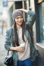Thinking, holiday and city with woman, coffee and morning walk with fashion and getaway trip. Person, New York and girl Royalty Free Stock Photo