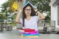 Thinking idea student girl with glasses and books on desk, Bored Royalty Free Stock Photo