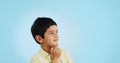 Thinking, inspiration and ideas, confused youth boy in studio with future or solution on blue background. Why, question