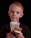 Thinking kid holding euro. Royalty Free Stock Photo