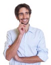 Thinking latin guy with beard looking sideways Royalty Free Stock Photo