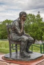 Thinking man on chair bronze statue in Sioux Falls, SD, USA