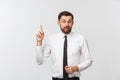 Thinking man isolated on white background. Closeup portrait of a casual young pensive businessman looking up at Royalty Free Stock Photo