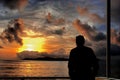 Thinking man on sea sunset. Royalty Free Stock Photo