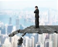 Thinking man standing on breaking puzzle ground Royalty Free Stock Photo