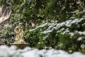 Thinking man statue at the Luxembourg Palace garden in a freezing winter day day just before spring