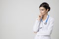 Thinking medical doctor woman with stethoscope. Royalty Free Stock Photo