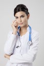 Thinking medical doctor woman with stethoscope. Royalty Free Stock Photo