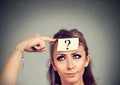 Thinking perplexed woman with question mark Royalty Free Stock Photo