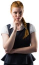 Thinking pretty redhead businesswoman with finger on face