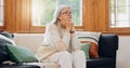 Thinking, reflection and senior woman on sofa in the living room with memory or dreaming face. Relax, idea and elderly Royalty Free Stock Photo