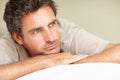 Thinking, relax and mature man in bed in the morning after nap, break or comfortable at home. Daydreaming, idea and male Royalty Free Stock Photo