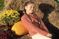 Thinking about. small girl big pumpkin. ready for halloween. autumn time. cheerful kid dried flower. fall composition