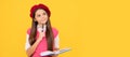 thinking teen school girl in french beret making notes in notepad. Portrait of schoolgirl student, banner header. School