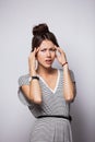 Thinking, tired or ill with headache young woman, isolated over white background. Royalty Free Stock Photo