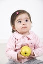 Thinking toddler with an apple Royalty Free Stock Photo