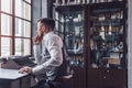 Thinking young man at the desk Royalty Free Stock Photo