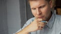 Thinking young man in the office Royalty Free Stock Photo