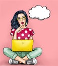 Thinking young woman with open mouth looking up on empty bubble sitting with laptop. Royalty Free Stock Photo