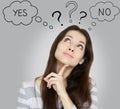 Thinking young woman with yes or no Royalty Free Stock Photo