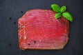 thinly sliced ham on a black board Royalty Free Stock Photo