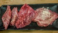 Thinly sliced Japanese wagyu beef on grille for barbecue. Yakiniku style