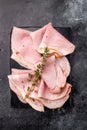 Thinly Sliced Pork Ham Prosciutto Cotto. black background. top view Royalty Free Stock Photo