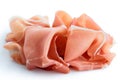 Thinly sliced Prosciutto ham. Isolated on white