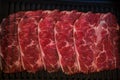 Thinly sliced of raw beef on tray prepare for customer cook Shabu Shabu or Sukiyaki Royalty Free Stock Photo